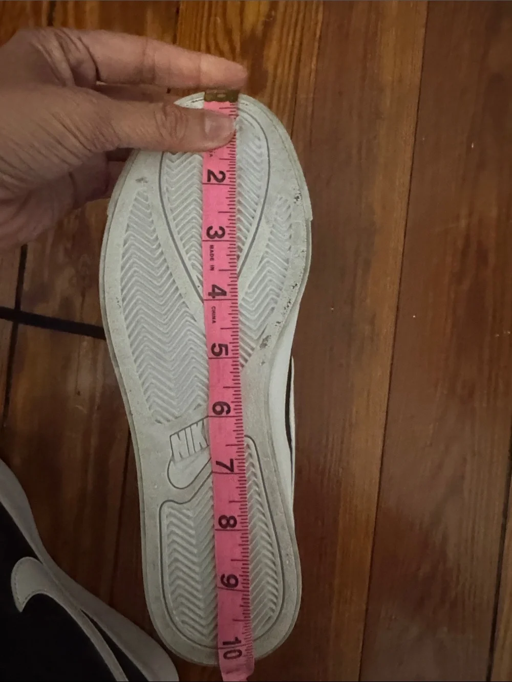 Nike Black Low-Top Sneakers with White Swoosh